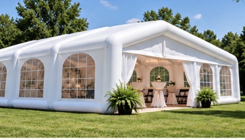 White inflatable event tent on a lawn